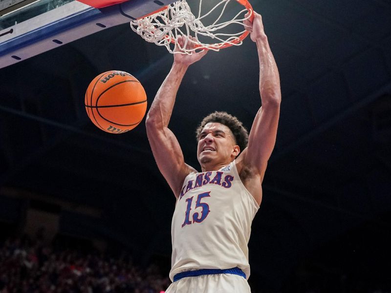 Dec 22, 2023; Lawrence, Kansas, USA; Kansas Jayhawks guard Kevin McCullar Jr. (15) dunks the ball against the Yale Bulldogs during the second half at Allen Fieldhouse. Mandatory Credit: Denny Medley-USA TODAY Sports