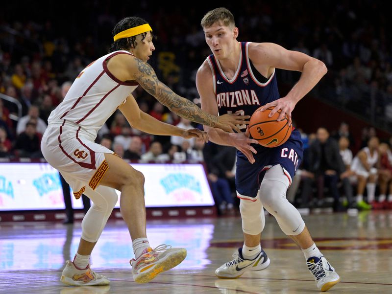 Mar 2, 2023; Los Angeles, California, USA; USC Trojans guard Tre White (22) defends Arizona Wildcats guard Pelle Larsson (3) in the second half at Galen Center. Mandatory Credit: Jayne Kamin-Oncea-USA TODAY Sports