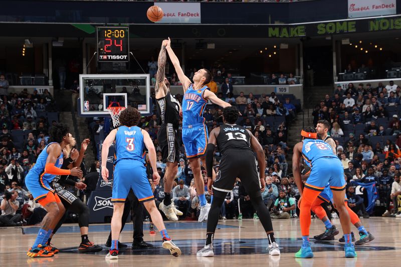 MEMPHIS, TN - NOVEMBER 18: Steven Adams #4 of the Memphis Grizzlies and Aleksej Pokusevski #17 of the Oklahoma City Thunder go up for the opening tip off during the game on November 18, 2022 at FedExForum in Memphis, Tennessee. NOTE TO USER: User expressly acknowledges and agrees that, by downloading and or using this photograph, User is consenting to the terms and conditions of the Getty Images License Agreement. Mandatory Copyright Notice: Copyright 2022 NBAE (Photo by Joe Murphy/NBAE via Getty Images)