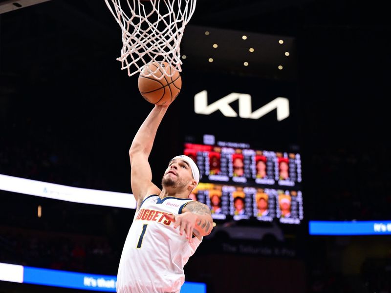 ATLANTA, GA - DECEMBER 8: Michael Porter Jr. #1 of the Denver Nuggets dunks the ball during the game against the Atlanta Hawks on December 8, 2024 at State Farm Arena in Atlanta, Georgia.  NOTE TO USER: User expressly acknowledges and agrees that, by downloading and/or using this Photograph, user is consenting to the terms and conditions of the Getty Images License Agreement. Mandatory Copyright Notice: Copyright 2024 NBAE (Photo by Adam Hagy/NBAE via Getty Images)