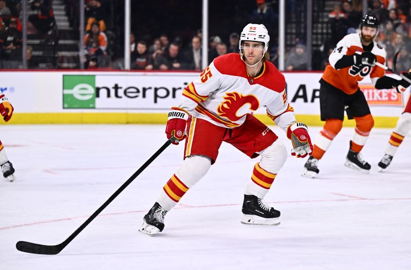 Jan 6, 2024; Philadelphia, Pennsylvania, USA; Calgary Flames defenseman Noah Hanifin (55) in action against the Philadelphia Flyers in the second period at Wells Fargo Center. Mandatory Credit: Kyle Ross-USA TODAY Sports