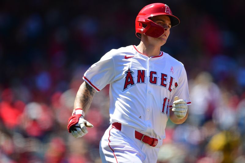 May 12, 2024; Anaheim, California, USA; Los Angeles Angels center fielder Mickey Moniak (16) runs after hitting a single against the Kansas City Royals during the sixth inning at Angel Stadium. Mandatory Credit: Gary A. Vasquez-USA TODAY Sports