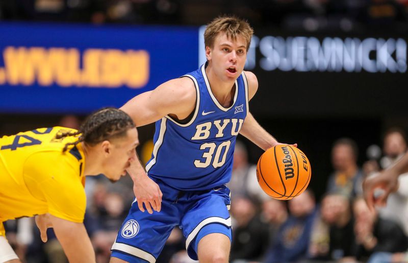 Feb 3, 2024; Morgantown, West Virginia, USA; Brigham Young Cougars guard Dallin Hall (30) dribbles the ball during the first half against the West Virginia Mountaineers at WVU Coliseum. Mandatory Credit: Ben Queen-USA TODAY Sports