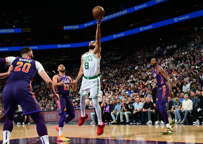 PHOENIX, AZ - MARCH  9: Derrick White #9 of the Boston Celtics shoots the ball during the game against the Phoenix Suns on March 9, 2024 at Footprint Center in Phoenix, Arizona. NOTE TO USER: User expressly acknowledges and agrees that, by downloading and or using this photograph, user is consenting to the terms and conditions of the Getty Images License Agreement. Mandatory Copyright Notice: Copyright 2024 NBAE (Photo by Kate Frese/NBAE via Getty Images)