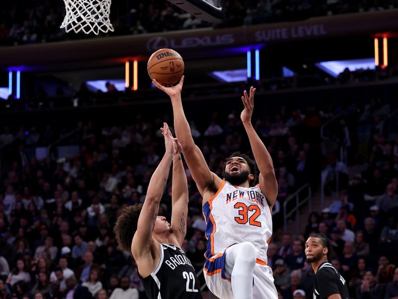 NEW YORK, NEW YORK - NOVEMBER 17: Karl-Anthony Towns #32 of the New York Knicks shoots the ball against the Brooklyn Nets during the second half at Madison Square Garden on November 17, 2024 in New York City. NOTE TO USER: User expressly acknowledges and agrees that, by downloading and or using this photograph, User is consenting to the terms and conditions of the Getty Images License Agreement.  (Photo by Luke Hales/Getty Images)