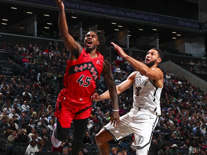 BROOKLYN, NY - OCTOBER 18: Davion Mitchell #45 of the Toronto Raptors shoots the ball during the game on October 18, 2024 at Barclays Center in Brooklyn, New York. NOTE TO USER: User expressly acknowledges and agrees that, by downloading and or using this Photograph, user is consenting to the terms and conditions of the Getty Images License Agreement. Mandatory Copyright Notice: Copyright 2024 NBAE (Photo by David L. Nemec/NBAE via Getty Images)