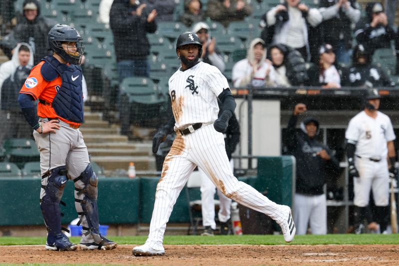 May 4, 2025; Chicago, Illinois, USA; Chicago White Sox center fielder Luis Robert Jr. (88) scores against the Houston Astros during the sixth inning at Rate Field. Mandatory Credit: Kamil Krzaczynski-Imagn Images