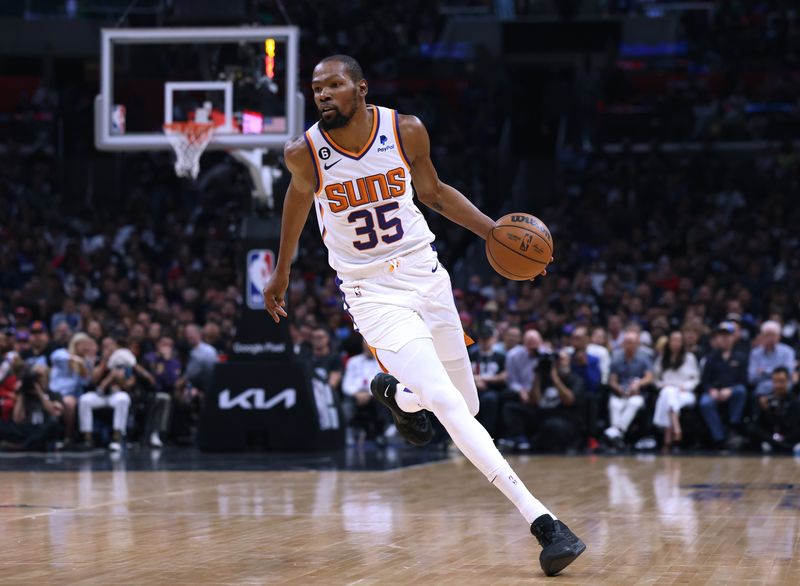 LOS ANGELES, CALIFORNIA - APRIL 22: Kevin Durant #35 of the Phoenix Suns dribbles during a 112-100 win over the LA Clippers in Game Four of the Western Conference First Round Playoffs at Crypto.com Arena on April 22, 2023 in Los Angeles, California. NOTE TO USER: User expressly acknowledges and agrees that, by downloading and or using this photograph, User is consenting to the terms and conditions of the Getty Images License Agreement. (Photo by Harry How/Getty Images)