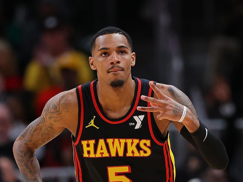 ATLANTA, GEORGIA - FEBRUARY 05:  Dejounte Murray #5 of the Atlanta Hawks reacts after hitting a three-point basket against the LA Clippers during the fourth quarter at State Farm Arena on February 05, 2024 in Atlanta, Georgia.  NOTE TO USER: User expressly acknowledges and agrees that, by downloading and/or using this photograph, user is consenting to the terms and conditions of the Getty Images License Agreement.  (Photo by Kevin C. Cox/Getty Images)