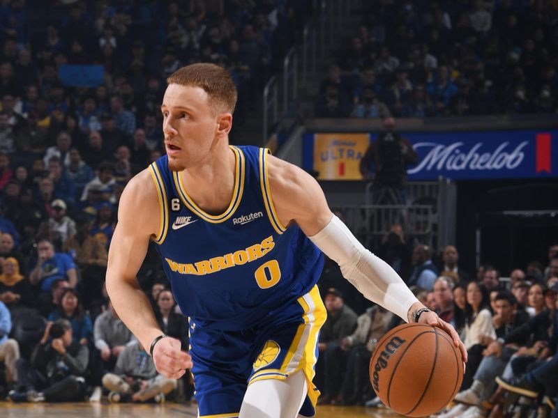 SAN FRANCISCO, CA - DECEMBER 27: Donte DiVincenzo #0 of the Golden State Warriors dribbles the ball during the game against the Charlotte Hornets on December 27, 2022 at Chase Center in San Francisco, California. NOTE TO USER: User expressly acknowledges and agrees that, by downloading and or using this photograph, user is consenting to the terms and conditions of Getty Images License Agreement. Mandatory Copyright Notice: Copyright 2022 NBAE (Photo by Noah Graham/NBAE via Getty Images)