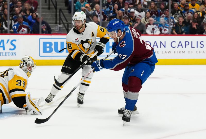 Mar 24, 2024; Denver, Colorado, USA; Colorado Avalanche left wing Jonathan Drouin (27) shoots and scores an overtime goal on Pittsburgh Penguins goaltender Alex Nedeljkovic (39) and defenseman Kris Letang (58) at Ball Arena. Mandatory Credit: Ron Chenoy-USA TODAY Sports