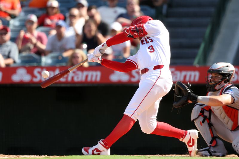 Sep 15, 2024; Anaheim, California, USA;  Los Angeles Angels left fielder Taylor Ward (3) hits a home run during the eighth inning against the Houston Astros at Angel Stadium. Mandatory Credit: Kiyoshi Mio-Imagn Images