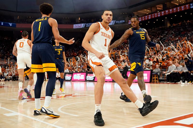 Feb 11, 2023; Austin, Texas, USA; Texas Longhorns forward Dylan Disu (1) reacts after dunking during the first half against the West Virginia Mountaineers at Moody Center. Mandatory Credit: Scott Wachter-USA TODAY Sports ac