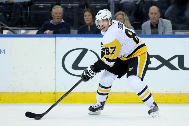 Oct 7, 2025; New York, New York, USA; Pittsburgh Penguins center Sidney Crosby (87) skates with the puck against the New York Rangers during the second period at Madison Square Garden. Mandatory Credit: Brad Penner-Imagn Images