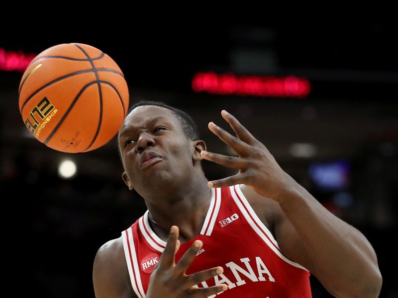 Feb 6, 2024; Columbus, Ohio, USA; Indiana Hoosiers forward Payton Sparks (24) loses control of the ball as Ohio State Buckeyes forward Zed Key (23) defends during the first half at Value City Arena. Mandatory Credit: Joseph Maiorana-USA TODAY Sports