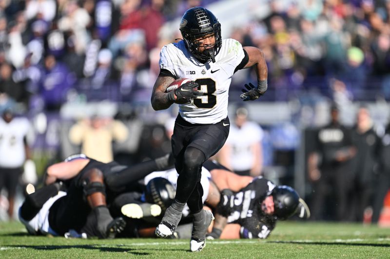 Nov 18, 2023; Evanston, Illinois, USA;  Purdue Boilermakers running back Tyrone Tracy Jr. (3) runs the ball for a touchdown in the third quarter against the Northwestern Wildcats at Ryan Field. Mandatory Credit: Jamie Sabau-USA TODAY Sports