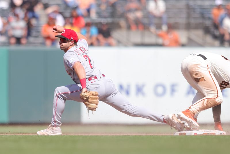 Aug 30, 2023; San Francisco, California, USA; Cincinnati Reds first baseman Spencer Steer (7) stretches out to make a play during the ninth inning against the San Francisco Giants at Oracle Park. Mandatory Credit: Sergio Estrada-USA TODAY Sports