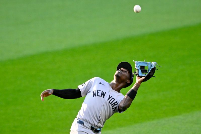 Apr 22, 2025; Cleveland, Ohio, USA; New York Yankees second baseman Jazz Chisholm Jr. (13) makes a catch in the fourth inning against the Cleveland Guardians at Progressive Field. Mandatory Credit: David Richard-Imagn Images