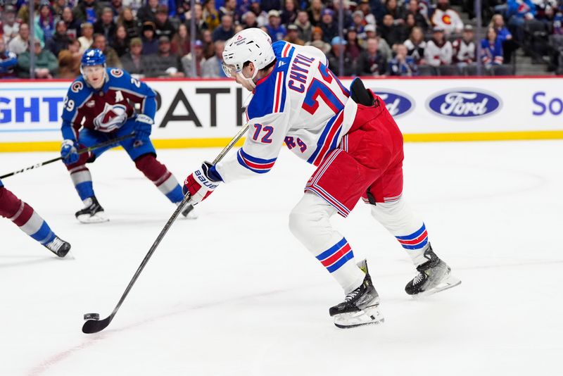 Jan 14, 2025; Denver, Colorado, USA; New York Rangers center Filip Chytil (72) shoots on goal in the first period against the Colorado Avalanche at Ball Arena. Mandatory Credit: Ron Chenoy-Imagn Images