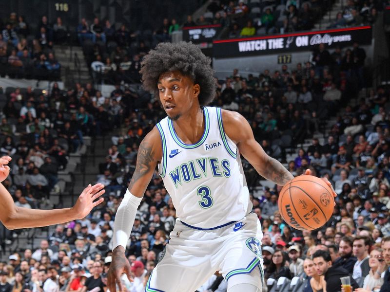 SAN ANTONIO, TX - JANUARY 27: Jaden McDaniels #3 of the Minnesota Timberwolves dribbles the ball during the game against the San Antonio Spurs on January 27, 2024 at the Frost Bank Center in San Antonio, Texas. NOTE TO USER: User expressly acknowledges and agrees that, by downloading and or using this photograph, user is consenting to the terms and conditions of the Getty Images License Agreement. Mandatory Copyright Notice: Copyright 2024 NBAE (Photos by Michael Gonzales/NBAE via Getty Images)