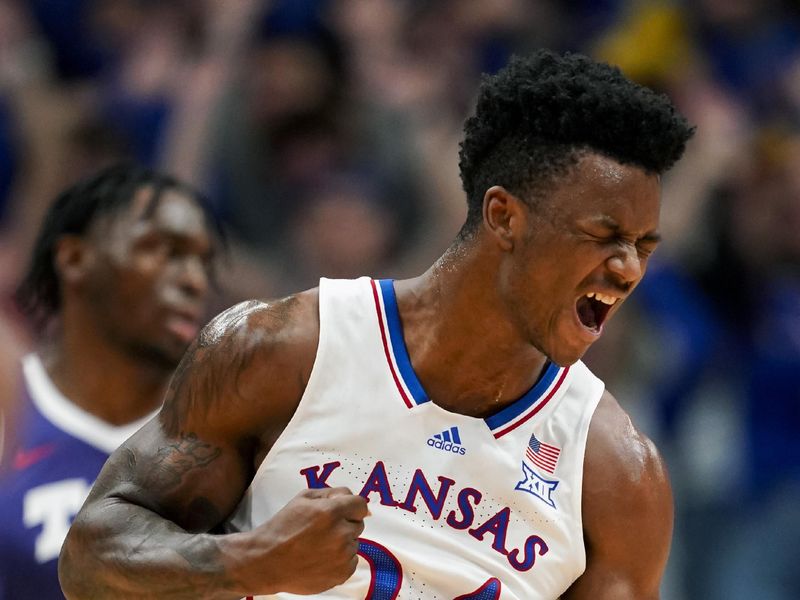 Jan 6, 2024; Lawrence, Kansas, USA; Kansas Jayhawks forward K.J. Adams Jr. (24) celebrates after scoring against the TCU Horned Frogs during the first half at Allen Fieldhouse. Mandatory Credit: Jay Biggerstaff-USA TODAY Sports