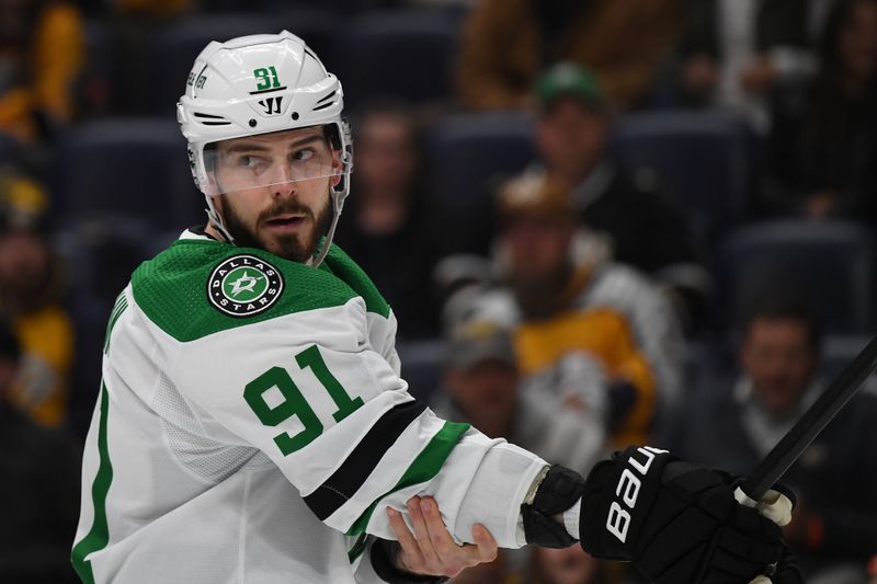 Dec 23, 2023; Nashville, Tennessee, USA; Dallas Stars center Tyler Seguin (91) waits for a face off during the first period against the Nashville Predators at Bridgestone Arena. Mandatory Credit: Christopher Hanewinckel-USA TODAY Sports