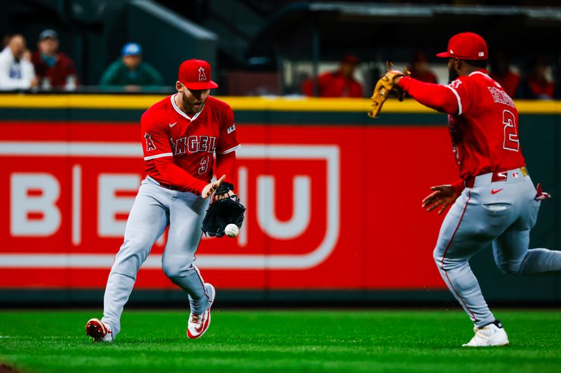 Apr 29, 2025; Seattle, Washington, USA; Los Angeles Angels left fielder Taylor Ward (3) fields a bloop single against the Seattle Mariners during the second inning at T-Mobile Park. Mandatory Credit: Joe Nicholson-Imagn Images