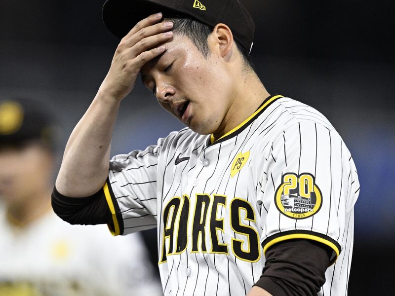 Apr 30, 2024; San Diego, California, USA; San Diego Padres relief pitcher Yuki Matsui (1) reacts after recording the last out of the top of the eighth inning against the Cincinnati Reds at Petco Park. Mandatory Credit: Orlando Ramirez-USA TODAY Sports