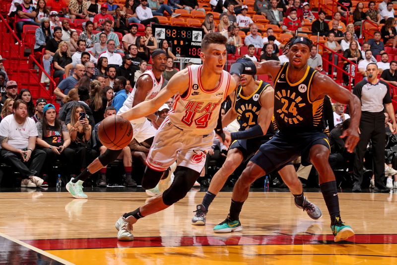 MIAMI, FL - FEBRUARY 8: Tyler Herro #14 of the Miami Heat drives to the basket against the Indiana Pacers on February 8, 2023 at Miami-Dade Arena in Miami, Florida. NOTE TO USER: User expressly acknowledges and agrees that, by downloading and or using this Photograph, user is consenting to the terms and conditions of the Getty Images License Agreement. Mandatory Copyright Notice: Copyright 2023 NBAE (Photo by Issac Baldizon/NBAE via Getty Images)