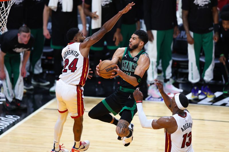 MIAMI, FLORIDA - APRIL 27: Jayson Tatum #0 of the Boston Celtics drives to the basket against Haywood Highsmith #24 of the Miami Heat during the second quarter in game three of the Eastern Conference First Round Playoffs at Kaseya Center on April 27, 2024 in Miami, Florida.  NOTE TO USER: User expressly acknowledges and agrees that, by downloading and or using this photograph, User is consenting to the terms and conditions of the Getty Images License Agreement. (Photo by Megan Briggs/Getty Images)