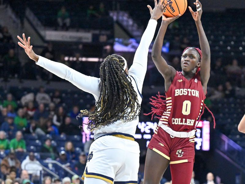 Jan 11, 2024; South Bend, Indiana, USA; Boston College Eagles forward Nene Ndiaye (0) shoots over Notre Dame Fighting Irish guard KK Bransford (14) in the first half at the Purcell Pavilion. Mandatory Credit: Matt Cashore-USA TODAY Sports