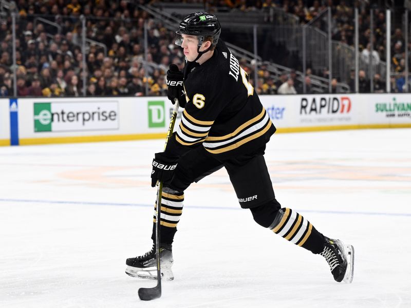 Mar 9, 2024; Boston, Massachusetts, USA; Boston Bruins defenseman Mason Lohrei (6) takes a shot against the Pittsburgh Penguins during the first period at the TD Garden. Mandatory Credit: Brian Fluharty-USA TODAY Sports