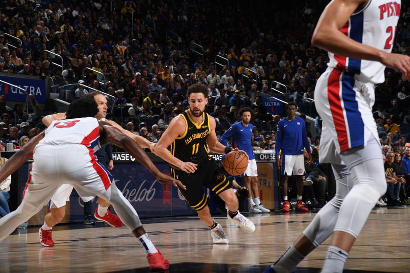 SAN FRANCISCO, CA - JANUARY 5: Klay Thompson #11 of the Golden State Warriors dribbles the ball during the game against the Detroit Pistons on January 5, 2024 at Chase Center in San Francisco, California. NOTE TO USER: User expressly acknowledges and agrees that, by downloading and or using this photograph, user is consenting to the terms and conditions of Getty Images License Agreement. Mandatory Copyright Notice: Copyright 2024 NBAE (Photo by Noah Graham/NBAE via Getty Images)