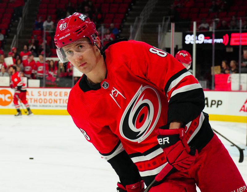 Dec 28, 2023; Raleigh, North Carolina, USA; Carolina Hurricanes center Martin Necas (88) skates during the warmups before the game against the Montreal Canadiens at PNC Arena. Mandatory Credit: James Guillory-USA TODAY Sports