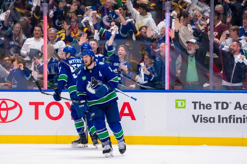 May 16, 2024; Vancouver, British Columbia, CAN; Vancouver Canucks defenseman Tyler Myers (57) and forward J.T. Miller (9) and defenseman Carson Soucy (7) celebrate after the game winning goal against the Edmonton Oilers during the third period in game five of the second round of the 2024 Stanley Cup Playoffs at Rogers Arena. Mandatory Credit: Bob Frid-USA TODAY Sports