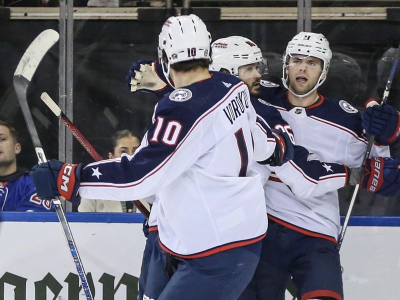 Nov 12, 2023; New York, New York, USA;  Columbus Blue Jackets center Adam Fantilli (11) celebrates with his teammates after scoring in the second period against the New York Rangers at Madison Square Garden. Mandatory Credit: Wendell Cruz-USA TODAY Sports