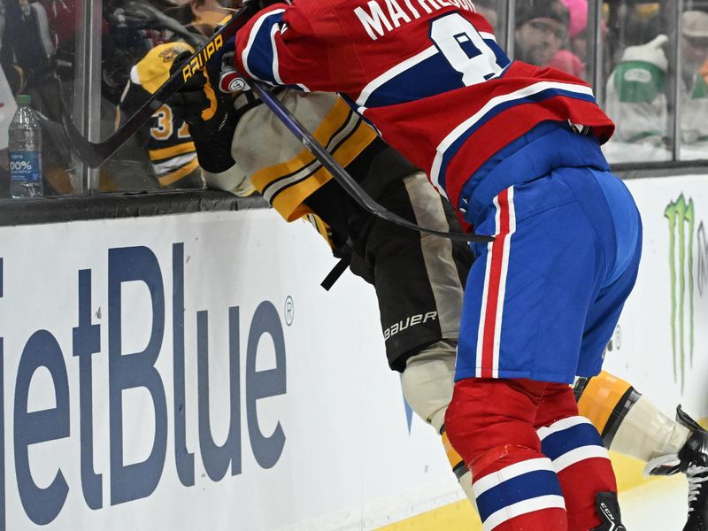 Jan 20, 2024; Boston, Massachusetts, USA; Montreal Canadiens defenseman Mike Matheson (8) checks Boston Bruins right wing David Pastrnak (88) into the boards during the first period at the TD Garden. Mandatory Credit: Brian Fluharty-USA TODAY Sports