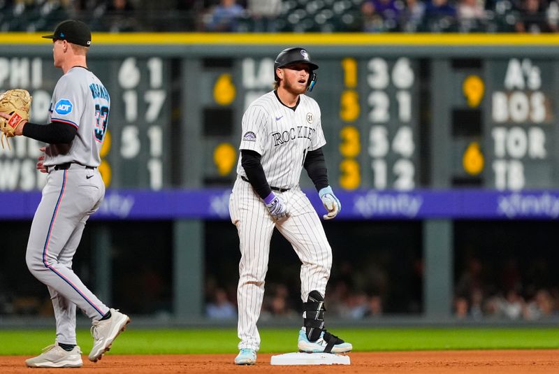 Sep 16, 2025; Denver, Colorado, USA; Colorado Rockies catcher Hunter Goodman (15) reacts after reaching second in the fourth inning against the Miami Marlins at Coors Field. Mandatory Credit: Ron Chenoy-Imagn Images