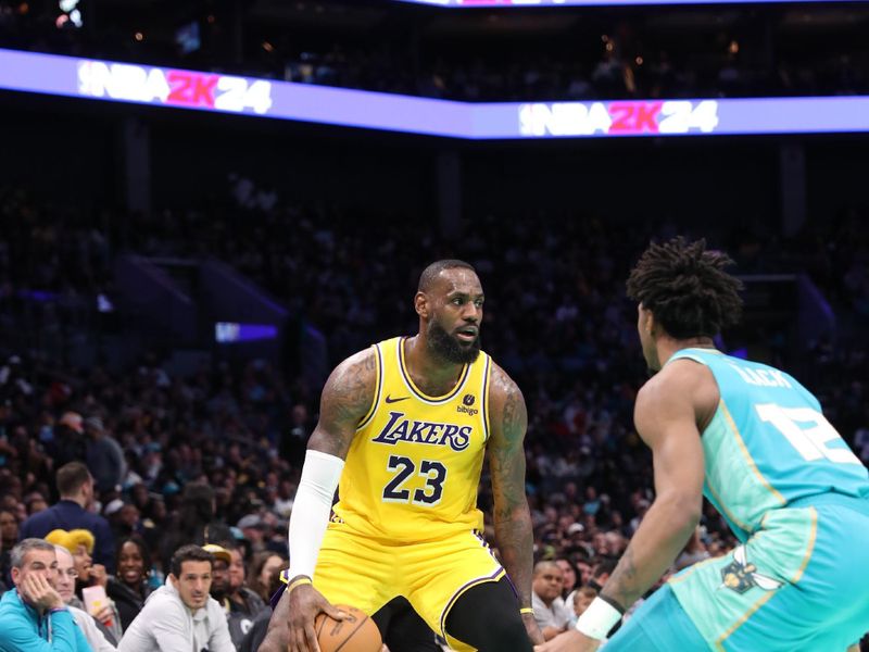 CHARLOTTE, NC - FEBRUARY 5: LeBron James #23 of the Los Angeles Lakers handles the ball during the game against the Charlotte Hornets on February 5, 2024 at Spectrum Center in Charlotte, North Carolina. NOTE TO USER: User expressly acknowledges and agrees that, by downloading and or using this photograph, User is consenting to the terms and conditions of the Getty Images License Agreement.  Mandatory Copyright Notice:  Copyright 2024 NBAE (Photo by Brock Williams-Smith/NBAE via Getty Images)