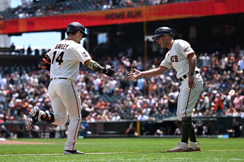 May 21, 2023; San Francisco, California, USA; San Francisco Giants catcher Patrick Bailey (14) is greetd by third base coach Mark Hallberg (91) after hitting a one run home run against the Miami Marlins during the second inning at Oracle Park. Mandatory Credit: Robert Edwards-USA TODAY Sports