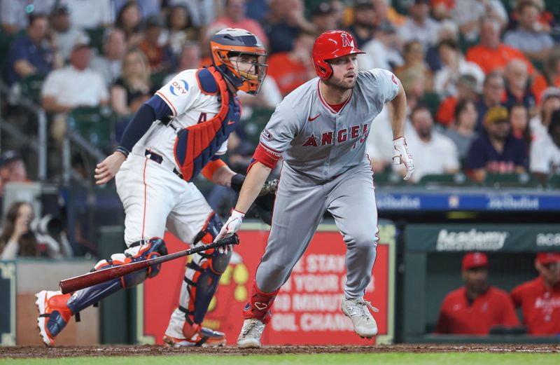 May 22, 2024; Houston, Texas, USA; Los Angeles Angels first baseman Nolan Schanuel (18) hits a single during the third inning against the Houston Astros at Minute Maid Park. Mandatory Credit: Troy Taormina-USA TODAY Sports