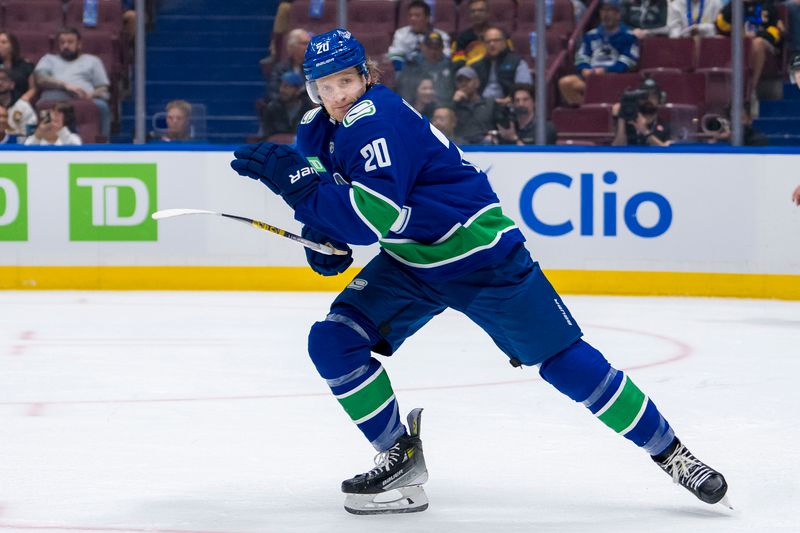 Sep 24, 2024; Vancouver, British Columbia, CAN; Vancouver Canucks forward Danton Heinen (20) skates against the Seattle Kraken during the first period at Rogers Arena. Mandatory Credit: Bob Frid-Imagn Images