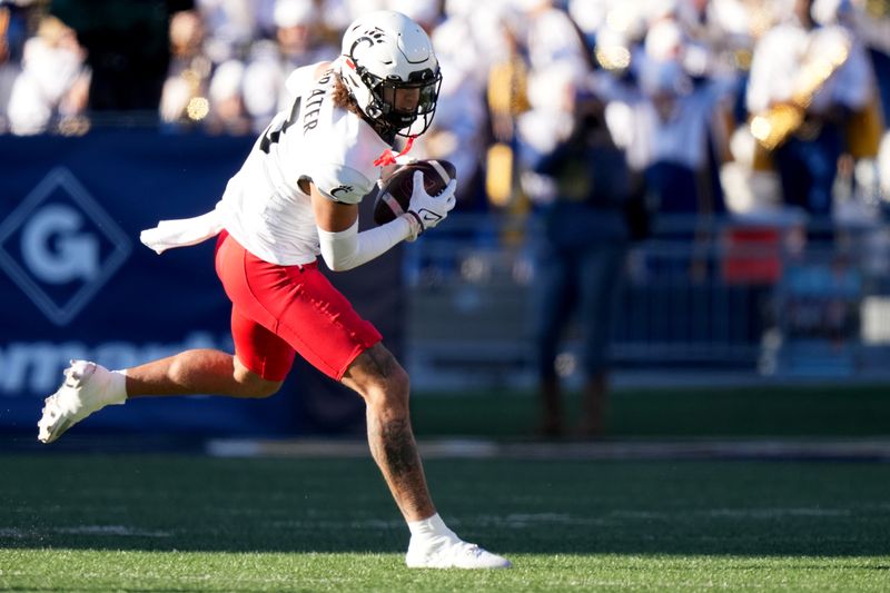 Nov 18, 2023; Morgantown, West Virginia, USA; Cincinnati Bearcats wide receiver Evan Prater (3) catches a pass against the West Virginia Mountaineers in the first quarter at Milan Puskar Stadium.  Mandatory Credit: Kareem Elgazzar-USA TODAY Sports