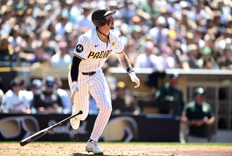 Jun 12, 2024; San Diego, California, USA; San Diego Padres center fielder Jackson Merrill (3) hits a home run against the Oakland Athletics during the fifth inning at Petco Park. Mandatory Credit: Orlando Ramirez-USA TODAY Sports