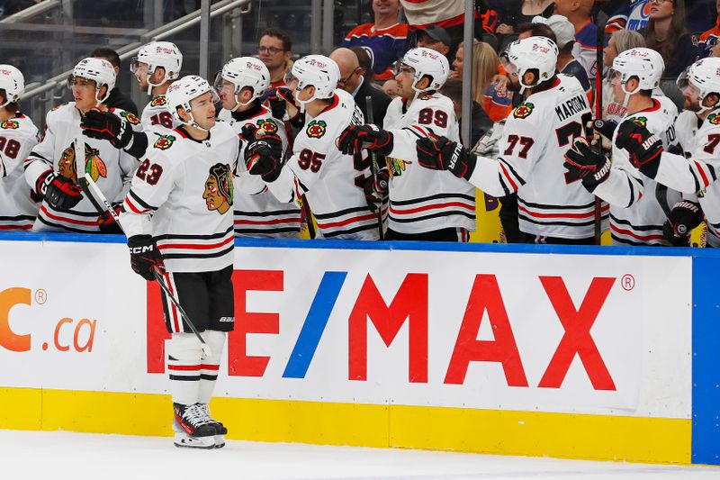 Oct 12, 2024; Edmonton, Alberta, CAN; The Chicago Blackhawks celebrate a goal scored by  forward Philipp Kurashev (23) during the first period against the Edmonton Oilers at Rogers Place. Mandatory Credit: Perry Nelson-Imagn Images