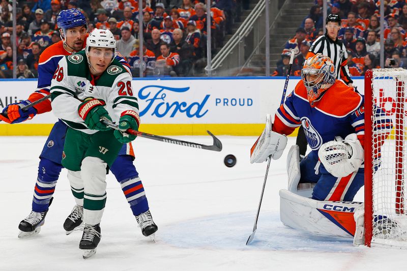 Dec 8, 2023; Edmonton, Alberta, CAN; Minnesota Wild forward Connor Dewar (26) tries to tip a shot past Edmonton Oilers goaltender Stuart Skinner (74) during the second period at Rogers Place. Mandatory Credit: Perry Nelson-USA TODAY Sports