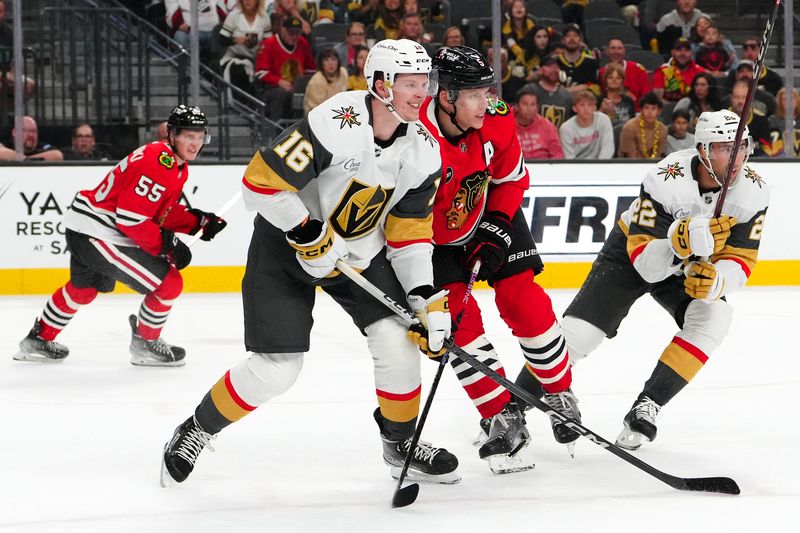 Oct 27, 2023; Las Vegas, Nevada, USA; Vegas Golden Knights left wing Pavel Dorofeyev (16) battles against Chicago Blackhawks defenseman Connor Murphy (5) during the third period at T-Mobile Arena. Mandatory Credit: Stephen R. Sylvanie-USA TODAY Sports