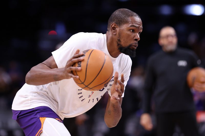 PHOENIX, ARIZONA - NOVEMBER 30: Kevin Durant #35 of the Phoenix Suns prepares for the game against the Golden State Warriors at Footprint Center on November 30, 2024 in Phoenix, Arizona. NOTE TO USER: User expressly acknowledges and agrees that, by downloading and or using this photograph, User is consenting to the terms and conditions of the Getty Images License Agreement.  (Photo by Chris Coduto/Getty Images)