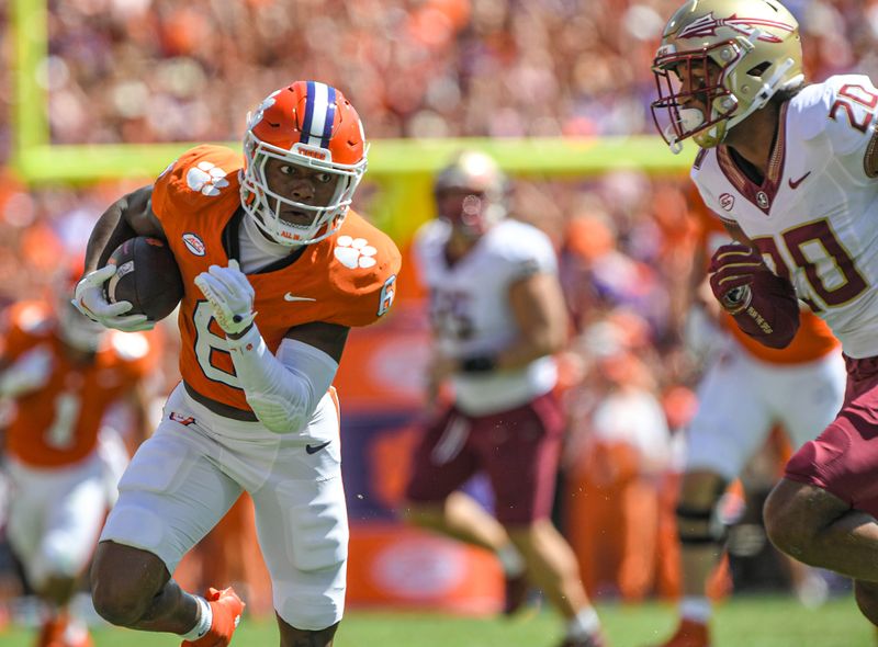 Sep 23, 2023; Clemson, South Carolina, USA; Clemson Tigers receiver Tyler Brown (6) runs against Florida State Seminoles defensive back Azareye'h Thomas (20) during the first quarter at Memorial Stadium. Mandatory Credit: Ken Ruinard-USA TODAY Sports