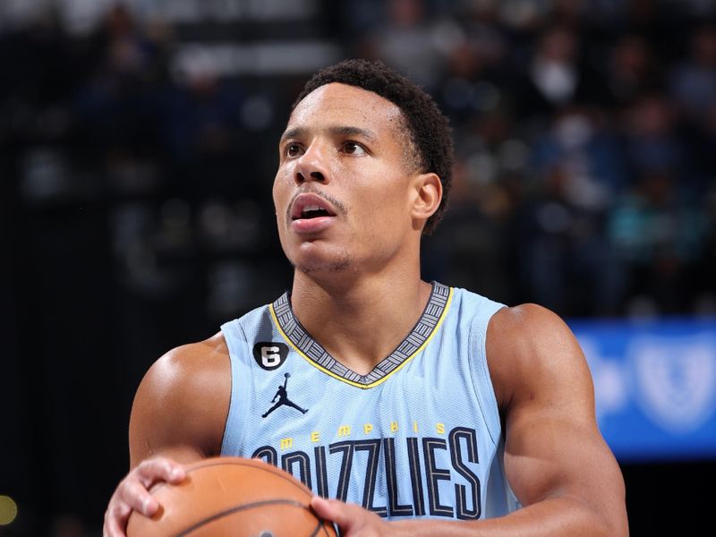 MEMPHIS, TN - MARCH 18: Desmond Bane #22 of the Memphis Grizzlies prepares to shoot a free throw during the game against the Golden State Warriors on March 18, 2023 at FedExForum in Memphis, Tennessee. NOTE TO USER: User expressly acknowledges and agrees that, by downloading and or using this photograph, User is consenting to the terms and conditions of the Getty Images License Agreement. Mandatory Copyright Notice: Copyright 2023 NBAE (Photo by Joe Murphy/NBAE via Getty Images)